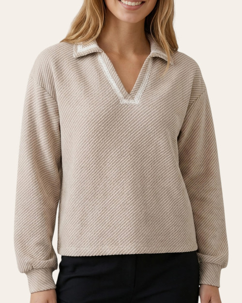 Model wearing the mocha Blanket Stitch Collared Knit Top with a v-shaped collared neckline and cuffed sleeves.