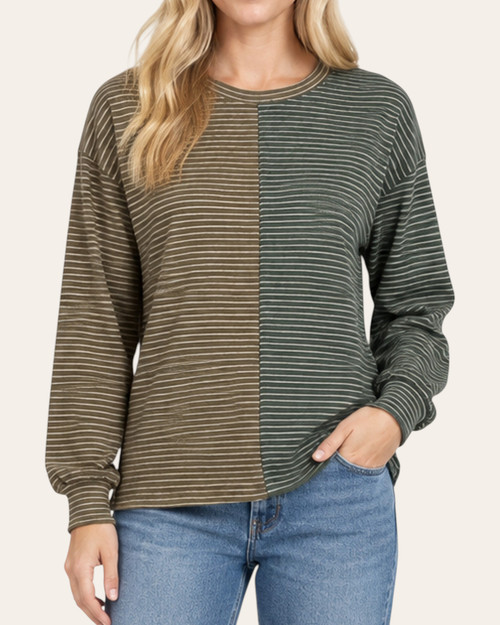 Front view of a model in the Beacon Striped Knit Top - Olive, showing a crew neckline and contrasting striped panels.
