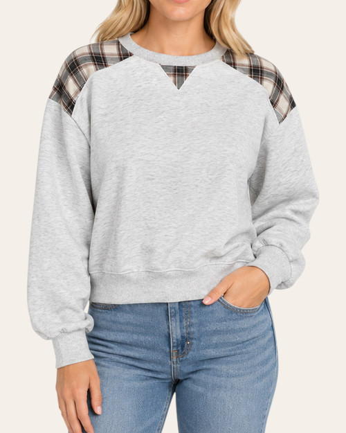 Front view of the Sloane Plaid Detail Sweatshirt, showing a round neckline, V-shaped plaid insert and heathered grey body.