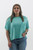 Experience the blend of comfort and style with this soft aqua ribbed top, a spring essential at Trendy Threads Boutique. Featuring a casual chest pocket and relaxed sleeves, it pairs effortlessly with your favorite denim.