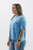 Step into spring with this effortlessly cool sky blue acid-washed tee from Trendy Threads Boutique, featuring rolled sleeves for that perfect blend of comfort and style