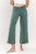 A close-up view of the Paige Cropped Jeans by Vervet, showing the dark green colored denim, wide leg cropped fit, and button/zip closure, styled with a simple white top.