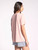 Rear view of a woman in the Kim Tee featuring a crew style neckline and a relaxed bodice in a spring-perfect soft peach color, emphasizing comfort and versatility.

