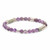 A sophisticated bracelet showcasing a range of purple semi-precious gemstones, from light lavender to deep amethyst, interspersed with silver-plated brass accents and muted green polymer clay discs on a flexible stretch cord.