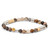 Chic bracelet crafted with varied shades of Mexican Onyx beads in earthy browns and creams, paired with gleaming silver-plated brass accents and beige polymer clay discs, arranged on a flexible stretch cord.
