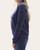 Side profile of a woman wearing the vintage navy baseball graphic sweatshirt showing the relaxed fit.