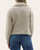 Back view of the pale beige ribbed half-zip pullover highlighting the relaxed drop shoulders and cozy fit.