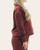 Side profile showing the slightly cropped silhouette and relaxed drop shoulders of the Thread and Supply Cora Pullover.