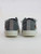 Rear view of Blowfish Malibu Beachside slip-on sneakers in washed grey fabric, featuring a multicolor fabric swatch detail at the heel and a low-profile rubber sole.