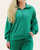 Front view of the Kelly Green Scuba Half Zip Pullover featuring a fold-over collar, kangaroo pocket, and white piping detail.