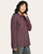 Woman in a wine heather button-up shirt, featuring dual chest pockets and a slightly open front, shown from a side angle.