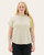 Front view of a textured short-sleeve knit top in a light hue with a crew neckline and rolled sleeves, styled with black jeans.
