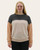 Front view of a woman wearing a relaxed colorblock ribbed top with round neckline and multicolor sleeves.