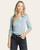 Front view of woman in the Dusty Blue Lucy Top, featuring long sleeves, button-up collar, and lightly fitted silhouette.