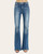 Front view of a model wearing high-rise flare jeans with subtle fading and raw hem detail. Front view of a model wearing high-rise flare jeans with subtle fading and raw hem detail.