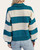 Back view of the Striped Rugby Grommet Top highlighting the wide teal and cream stripes and ribbed hem.