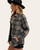 Side view of a woman in a grey mix women’s plaid shacket featuring front snap buttons and side pockets, paired with a black hat and casual fall outfit from Trendy Threads. Side view of a woman in a grey mix women’s plaid shacket featuring front snap buttons and side pockets, paired with a black hat and casual fall outfit from Trendy Threads.