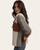 Side view of Blaire Color Block Sweater featuring soft cable knit texture, rust pocket detail, and cozy drape. Side view of Blaire Color Block Sweater featuring soft cable knit texture, rust pocket detail, and cozy drape.