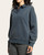 Side profile of a woman modeling the relaxed fit Thread and Supply Arizona Pullover in Dark Spruce.