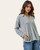 Side angle of grey ribbed pullover with pockets
