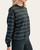 Model showing the stretch and comfort of the long sleeves on the green striped pullover.