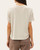 Back view of a woman wearing the short sleeve Sydney Ribbed Boxy Tee in a natural cream color.