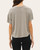 Back view of a woman wearing the short sleeve Sydney Ribbed Boxy Tee in a versatile heather grey.