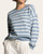 Front view of a woman wearing the ultra-soft Thread & Supply Preston crew neck sweater in dusty blue and white stripes.