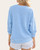Back view of the light blue corded pullover highlighting the vintage wash, ribbed texture, and relaxed drop-shoulder fit.