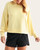 Front view of the lightweight, cropped Laguna drop shoulder sweatshirt in yellow glow.