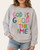 Front view of the heather grey God Is Good graphic sweatshirt featuring colorful painted lettering and a smiley sun face.