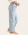 Side profile of the stretchy light wash Judy Blue high rise jeans paired with spring sandals.