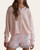 Front view of the Layla light pink knit cardigan with delicate button details, styled for spring.