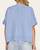 Back view of the Sasha light blue sweater highlighting the center vertical seam and ribbed hem design.