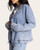 Close up side profile of the women's lightweight Tencel denim jacket featuring a relaxed fit and lapel collar.
