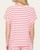 Back view of the Carla red and white striped knit top on model.