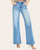 Front view of the light wash Risen High Rise Curved Seam Jeans highlighting the unique front leg detail