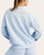 Back view of the Scuba Luxe Mock Neck Pullover in Blue Frost showing the relaxed fit.