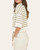Side profile of the Casey half-sleeve striped women's sweater showing the drop shoulder design and relaxed fit.