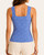 Back view of the denim blue floral jacquard seamless tank top highlighting the textured floral pattern and stretchy fitted summer silhouette.