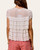 Back view of the ivory tiered ruffle lace blouse showing the delicate lace detailing.