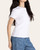 Side profile view of the slightly fitted white Thread and Supply Annie Tee.