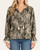 Woman modeling the front of the Freya Floral Print Blouse in olive green with abstract floral design and tassel neckline.