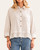 Woman wearing a relaxed fit striped ruffle hem top with button front closure and 3/4 sleeves.