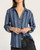 Front view of the lightweight Tencel Thread and Supply Anna striped shirt worn casually unbuttoned.