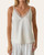 Woman modeling the Ivory Two Way Lace Trim Camisole from a local Roscoe South Dakota boutique