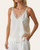 Close up of the satin ivory camisole with lace trim neckline styled for work or school