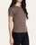 Side profile of a model modeling the Thread and Supply Annie crew neck tee in latte black stripe