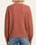 Back view of the women's Cadence Textured Top in rust, showing the ribbed hem and medium weight knit perfect for fall in South Dakota.