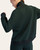 Back view of the regency green mock neck pullover highlighting the ribbed hem details